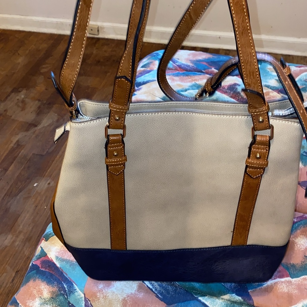 This is a beautiful shoulder bag Navy blue, Tan and Brown